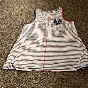 Tank top with stripes and a pocket on the front with starts on it